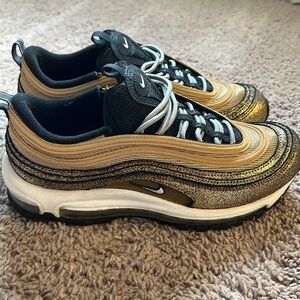 Gold metallic and black Nike Shoes never worn